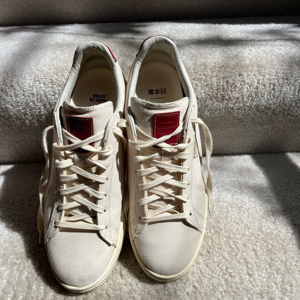 Pristine Cream Sneaker with Striking Red Leather Accent. Japanese Designer shoe.